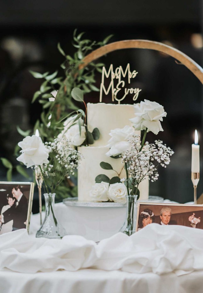 White wedding cake with fresh flowers by The Rós Café, Co. Clare