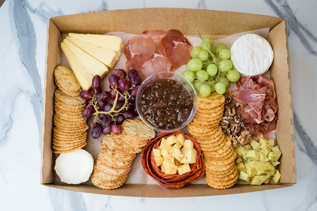 Catering grazing box with cheeses, cured meats, crackers and grapes by The Rós Café, Co. Clare