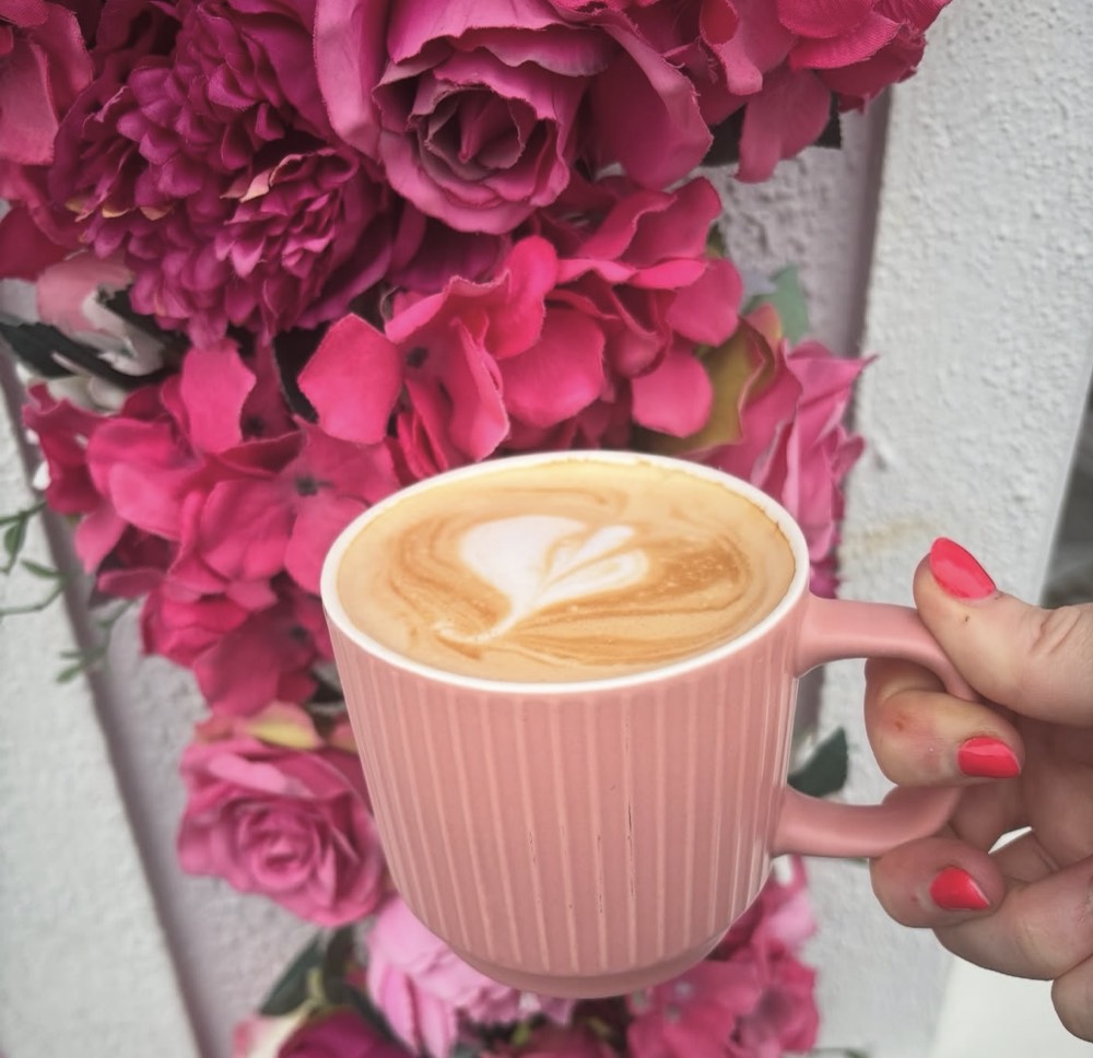Barista coffee with latte art in a pink mug at The Rós Café, Newmarket on Fergus, Co. Clare