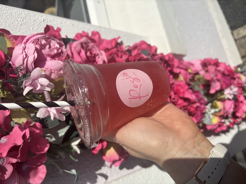 The Rós Café 'Rosie' iced drink against the pink floral wall, Co. Clare